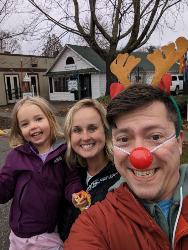 Enjoying Our Local Christmas Parade. Eric Caught a Rudolph Nose